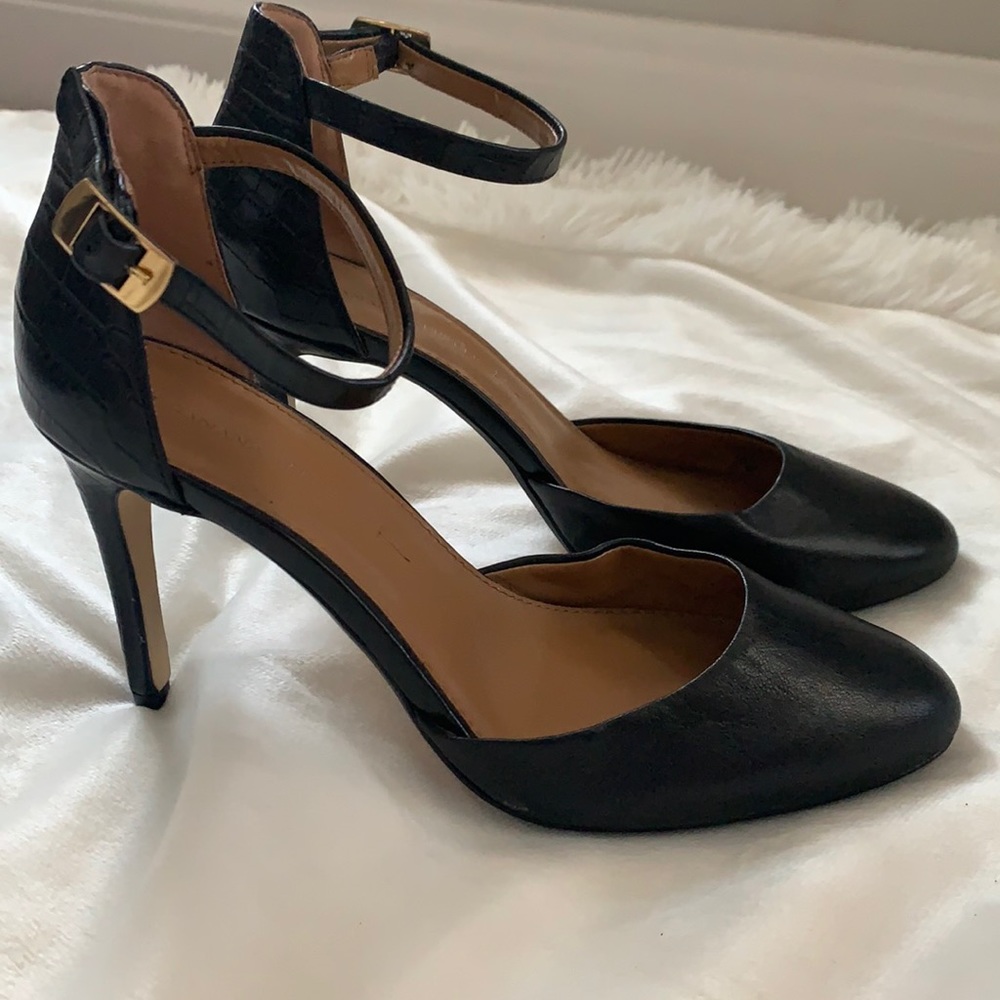 Black leather pumps
